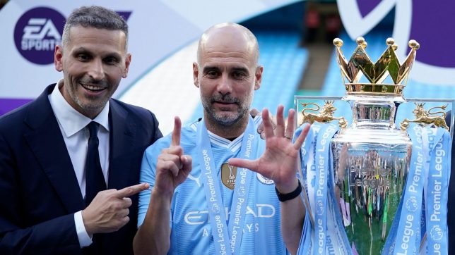 Manchester City's head coach Pep Guardiola, right, and Manchester City chairman Khaldoon Al Mubarak celebrate with the Premier League trophy after the English Premier League soccer match between Manchester City and West Ham United at the Etihad Stadium in Manchester, England, Sunday, May 19, 2024.