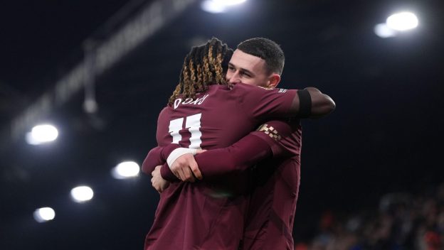 Jeremy Doku and Phil Foden celebrate a thumping win in January 2025.