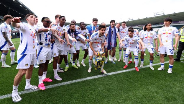 The 2025 Championship winners celebrate with the trophy.