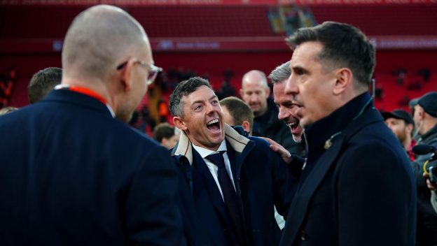 Rory McIlroy (centre) on the pitch ahead of the Premier League match at Anfield, Liverpool. Picture date: Sunday December 17, 2023.