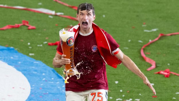Munich, Germany. 10th May, 2025. Soccer: Bundesliga, Bayern Munich - Borussia Mönchengladbach, matchday 33 at the Allianz Arena. Munich's Thomas Müller celebrates after the game with a beer shower.