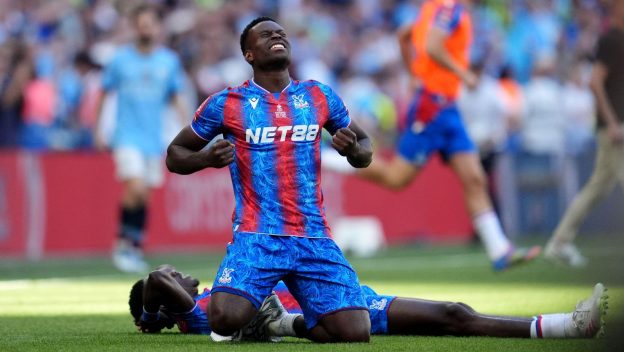 Marc Guehi celebrates winning the 2025 FA Cup final.