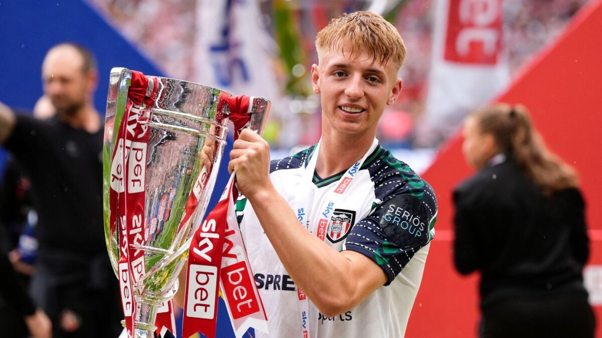 The 2025 play-off final matchwinner poses with the trophy.