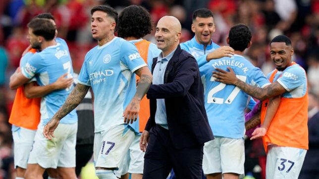 Enzo Fernandez of Manchester City celebrates at the final whistle with Enzo Maresca manager of Manchester City during the Manchester United vs Manchester City Premier League match at Old Trafford, Manchester.