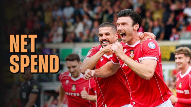 Wrexham forward Kieffer Moore celebrates alongside Conor Coady