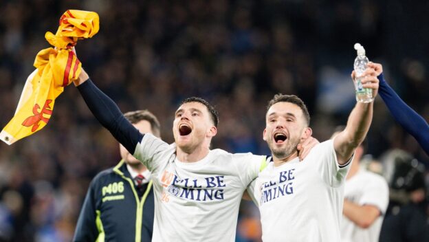 GLASGOW, SCOTLAND - NOVEMBER 18: Scotland's Andrew Robertson (L) and John McGinn celebrate as Scotland qualify for the 2026 FIFA World Cup during a Qualifying match between Scotland and Denmark at Hampden Park, on November 18 2025, in Glasgow, Scotland.
