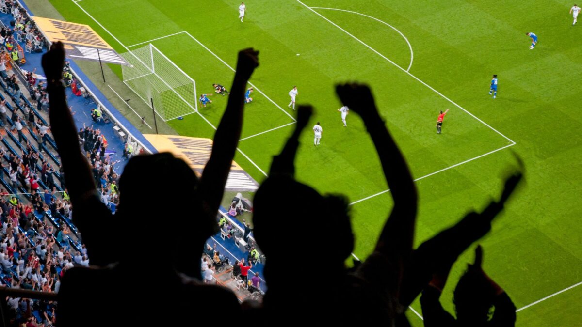 Real Madrid fans celebrate a goal at the Bernabeu. This could be you.