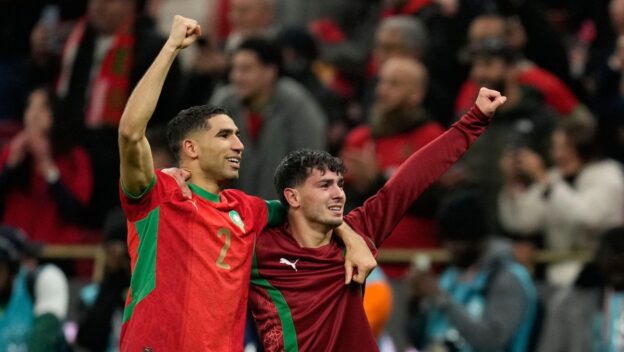 Morocco's Achraf Hakimi, left, and Brahim Abdelkader Díaz celebrate after winning the penalty shootout during the Africa Cup of Nations semi-final match between Nigeria and Morocco in Rabat, Morocco, Wednesday, Jan. 14, 2026.