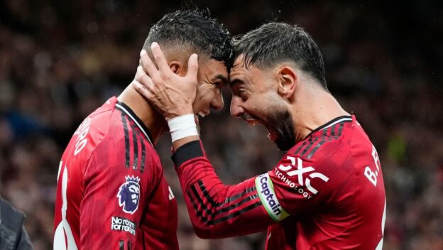 Manchester United's Casemiro (left) celebrates with Bruno Fernandes after scoring his sides second goal during the Premier League match at Old Trafford, Manchester. Picture date: Saturday September 20, 2025.