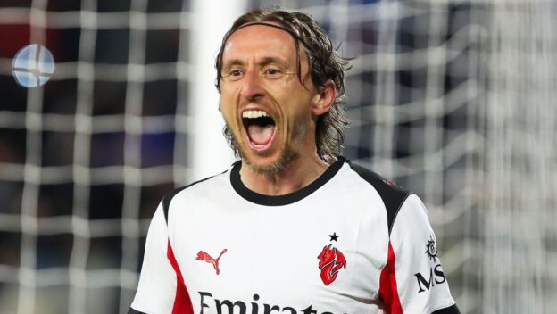 Modric celebrates scoring Milan's winner at Pisa.