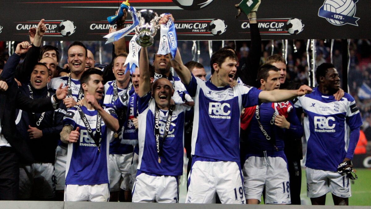 Birmingham's players celebrate with the trophy.