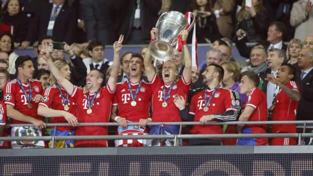 Munich's Arjen Robben celebrates with the trophy during the Champions League final match between Borussia Dortmund and Bayern Munich at Wembley Stadium in London, UK on May 25, 2013.