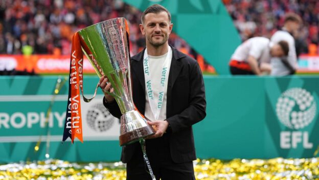 Luton Town manager Jack Wilshere celebrates with the trophy after winning the Vertu Trophy final at Wembley Stadium, London. Picture date: Sunday April 12, 2026.