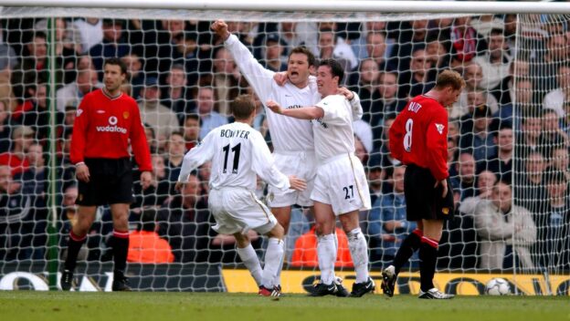 Mark Viduka celebrates scoring against Manchester United in 2002.