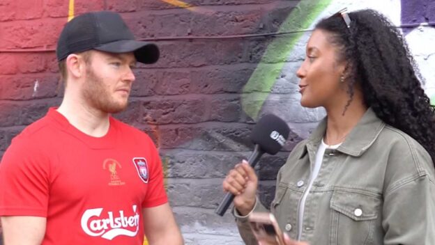 Liverpool fan being interviewed outside Anfield