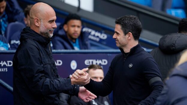 Manchester City's head coach Pep Guardiola shakes hand with Arsenal's manager Mikel Arteta during the English Premier League soccer match between Manchester City and and Arsenal, in Manchester, England, Sunday, April 19, 2026.