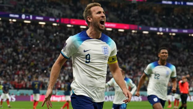 England's Harry Kane celebrates scoring their side's first goal of the game from the penalty spot during the FIFA World Cup Quarter-Final match at the Al Bayt Stadium in Al Khor, Qatar.