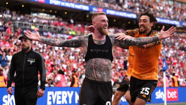 Oli McBurnie celebrates getting Hull City into the Premier League.