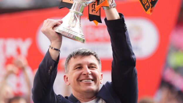 Hull City's manager celebrates winning the 2026 play-off final.