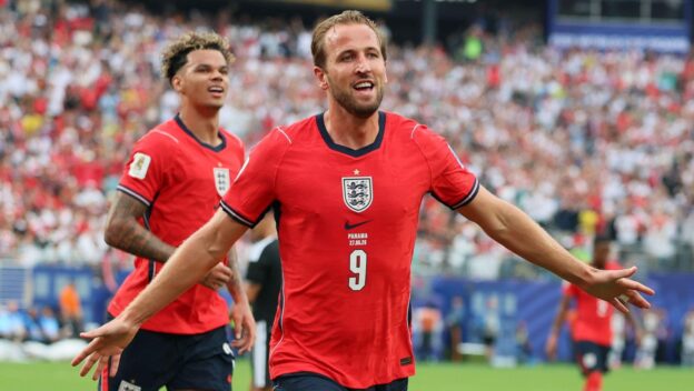 Harry Kane celebrates becoming England's record World Cup scorer.