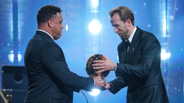 England's soccer player Harry Kane receives the player of the year trophy from Ronaldo Nazario during the Ballon d'Or ceremony at the London Palladium Theatre in London, England, Monday, Oct. 26, 2026 .